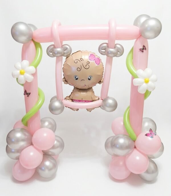 Baby Girl Premium Balloons: pink balloon swing with a baby girl foil balloon, white daisies, green vines, pink and silver balloon bases