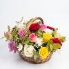 Mini Mix Bloom Basket: red, pink, lilac, yellow and white roses with white chrysanthemums and baby's breath in a wicker basket with a handle