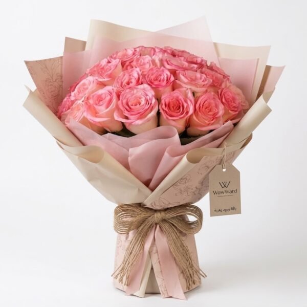 Pink Rose Bouquet: pink roses wrapped in pink and cream paper with a burlap bow and gift tag