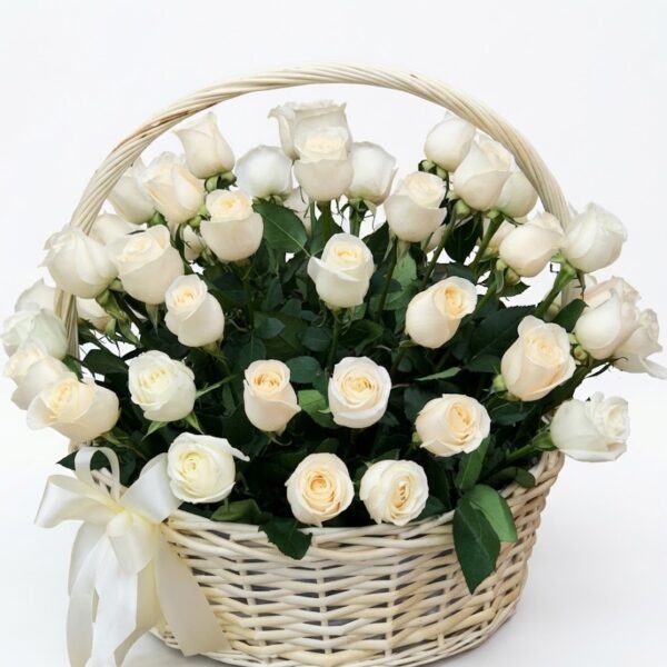 Pure Harmony Basket Pure Harmony Basket: white roses with cream centres and green leaves in a cream wicker basket with a handle and a cream satin bow