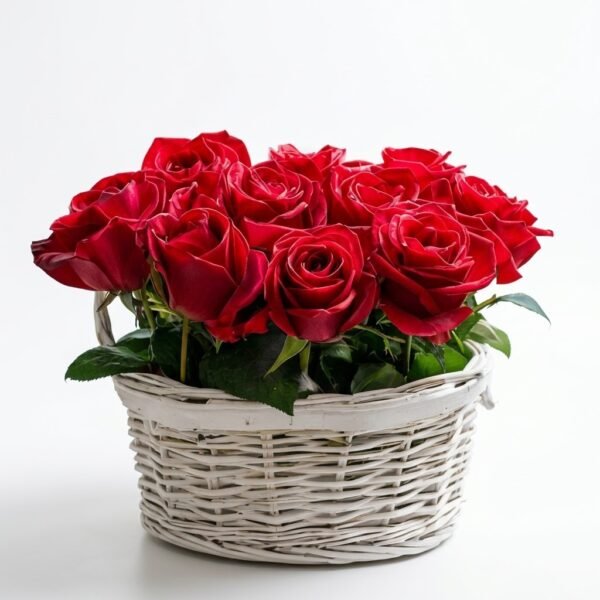 Red Mini Basket: red roses with green leaves in a small white wicker basket on a plain white background