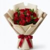 Red Rose Bouquet Red Rose Bouquet of red roses wrapped in layered cream paper and tied with a red satin bow