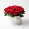 Red Velvet Bloom Box Red Velvet Bloom Box: red roses with green leaves in a white round box with a white satin ribbon knotted at the rim