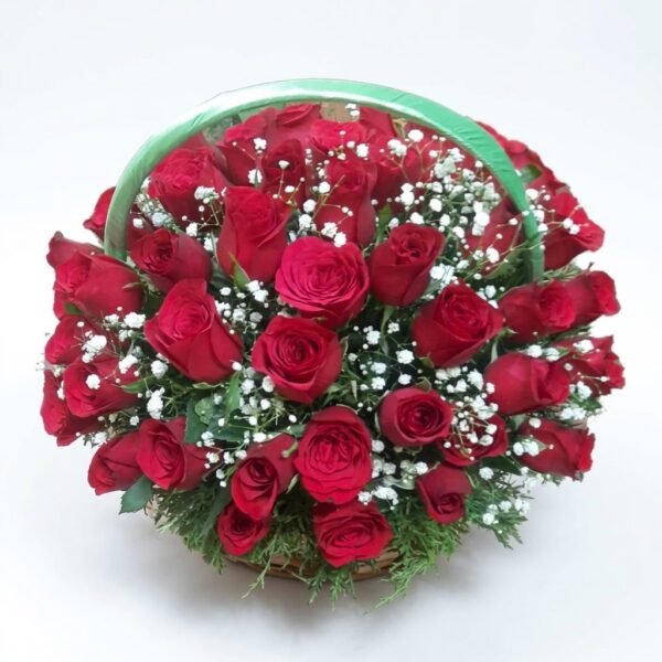 Red Whisper Basket Red Whisper Basket: round basket of red roses with white gypsophila and green sprigs under a green-wrapped handle