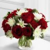 Crimson Grace Crimson Grace: red roses with white chrysanthemums and greenery in a round glass vase