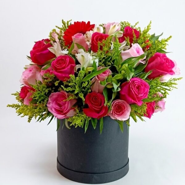 Mixed Pink Roses Box Mixed Pink Roses Box: pink and fuchsia roses, red gerbera and white alstroemeria in a round black box