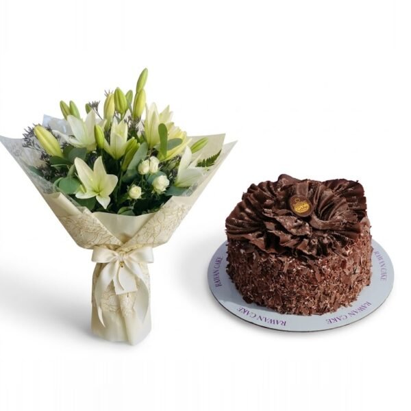 White Lilies & Chocolate Ruffle Cake White Lilies & Chocolate Ruffle Cake: white lilies and spray roses with eucalyptus in cream lace-pattern wrapping beside a chocolate cake topped with chocolate ruffles