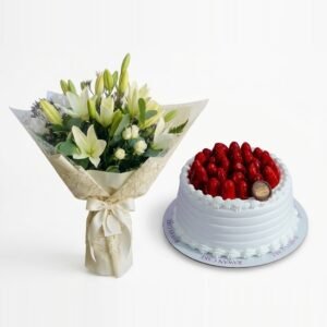 White Lilies & Strawberry Cake: white lilies and spray roses with eucalyptus in cream lace-pattern wrapping beside a white cream cake topped with glazed strawberries