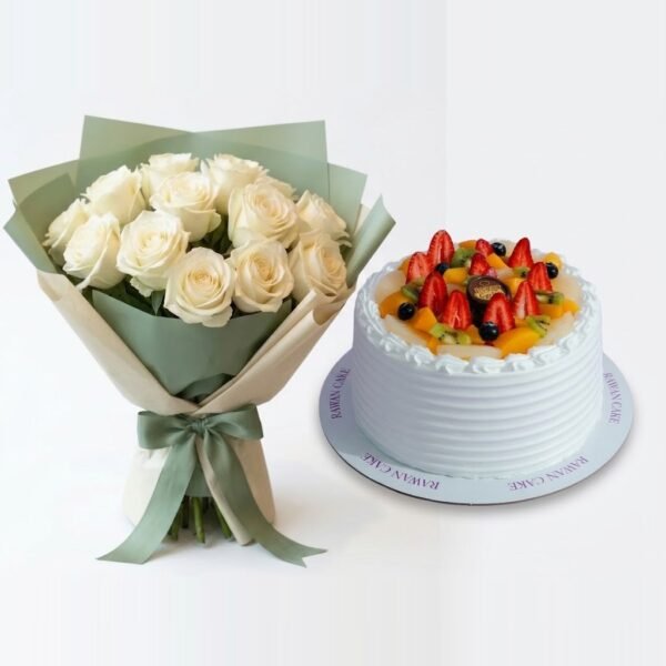 White Roses & Fruit Cake White Roses & Fruit Cake: white roses in sage green and cream wrapping with a green ribbon beside a white cream cake topped with strawberries, kiwi and blueberries